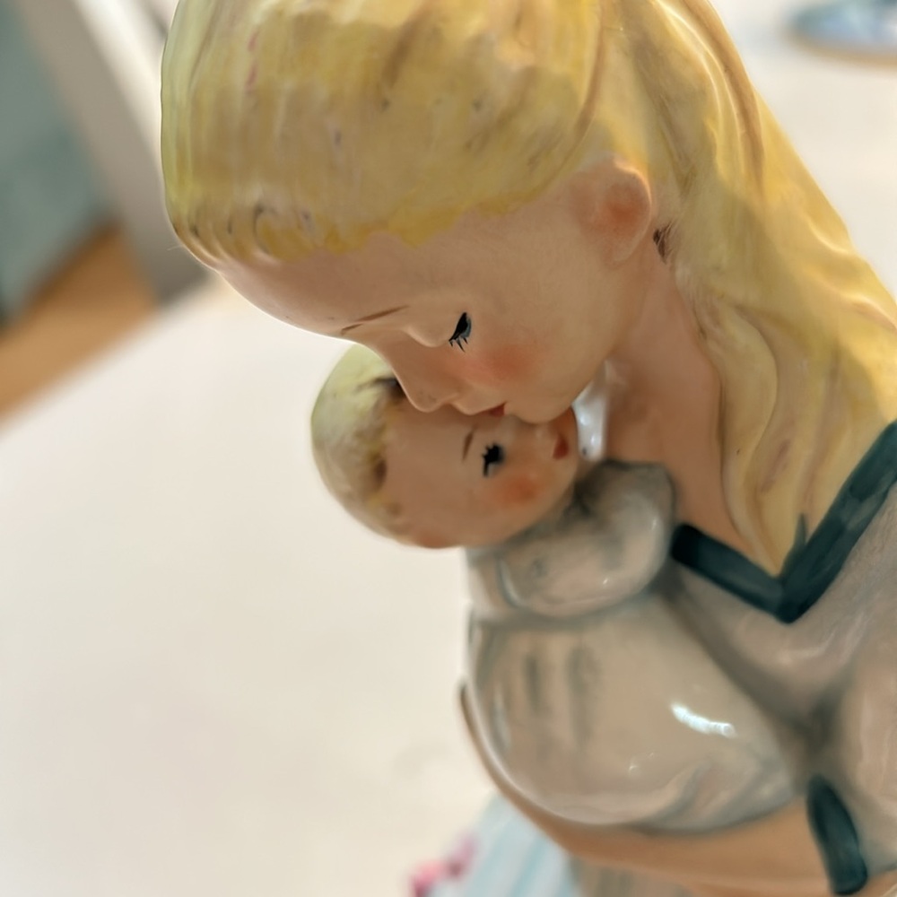 A beautiful statue of a woman with a baby